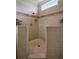 Walk-in shower with tiled walls and built-in seating at 2570 Oak St, Kissimmee, FL 34744