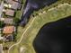Aerial view of the property, showcasing a golf course near a community of homes at 2806 Balforn Tower Way, Winter Garden, FL 34787
