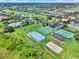 Aerial view of the community featuring a pool, tennis and basketball courts at 2806 Balforn Tower Way, Winter Garden, FL 34787