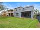 View of backyard with fenced perimeter and screened in patio at 2806 Balforn Tower Way, Winter Garden, FL 34787