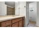 Bathroom with double vanity, neutral countertop, and ceramic tile flooring at 2806 Balforn Tower Way, Winter Garden, FL 34787
