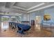 Large conference room featuring light blue walls, hardwood floors, and large windows for plenty of natural light at 2806 Balforn Tower Way, Winter Garden, FL 34787