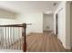Hallway features wood floors, white walls, and access to rooms and storage at 2806 Balforn Tower Way, Winter Garden, FL 34787