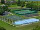 An aerial view of community sports facilities, including a tennis court, basketball court, and hockey rink at 2806 Balforn Tower Way, Winter Garden, FL 34787