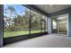 View of screened patio leading to a fenced backyard at 2806 Balforn Tower Way, Winter Garden, FL 34787