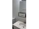 Clean bathroom with sink, toilet, and medicine cabinet at 5317 Curry Ford Rd # J101, Orlando, FL 32812