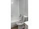Bright bathroom featuring a bathtub and toilet at 5317 Curry Ford Rd # J101, Orlando, FL 32812