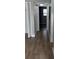 Clean hallway with tile floors and gray walls at 5317 Curry Ford Rd # J101, Orlando, FL 32812
