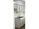 White kitchen cabinets, double sink, and tile floors at 5317 Curry Ford Rd # J101, Orlando, FL 32812