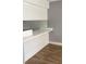 Kitchen boasts white cabinets and ample counter space at 5317 Curry Ford Rd # J101, Orlando, FL 32812