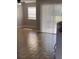 Living area with tile floor and access to backyard at 5317 Curry Ford Rd # J101, Orlando, FL 32812
