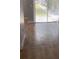Bright living room with tile flooring and sliding glass doors leading to the outdoors at 5317 Curry Ford Rd # J101, Orlando, FL 32812
