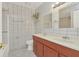 Bathroom with double vanity, tiled floors and walls at 113 Kristi Ann Ct # 113, Winter Springs, FL 32708