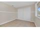 Simple bedroom with tile floors and double closets at 113 Kristi Ann Ct # 113, Winter Springs, FL 32708