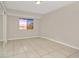 Spacious bedroom with large window and tile floors at 113 Kristi Ann Ct # 113, Winter Springs, FL 32708