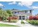 Tan two-story home with landscaping and walkway at 113 Kristi Ann Ct # 113, Winter Springs, FL 32708