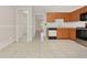 Kitchen with wood cabinets, stainless steel appliances, and tiled floor at 113 Kristi Ann Ct # 113, Winter Springs, FL 32708