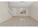 Living room with tile flooring and staircase at 113 Kristi Ann Ct # 113, Winter Springs, FL 32708