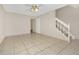 Living area with tile floors and staircase access at 113 Kristi Ann Ct # 113, Winter Springs, FL 32708