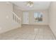 Living room with tile floors, stairs, and a window at 113 Kristi Ann Ct # 113, Winter Springs, FL 32708