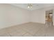 Spacious living room featuring tile floors and a ceiling fan at 113 Kristi Ann Ct # 113, Winter Springs, FL 32708