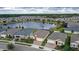 Neighborhood with pond and houses at 17833 Blazing Star Cir, Clermont, FL 34714