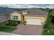 House in a residential community near a pond at 17833 Blazing Star Cir, Clermont, FL 34714