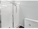 Bathroom with a glass shower and white tile at 17833 Blazing Star Cir, Clermont, FL 34714