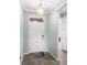 Bright entryway with a white door and wood-look tile floors at 17833 Blazing Star Cir, Clermont, FL 34714
