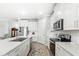 Modern kitchen with stainless steel appliances and white cabinets at 17833 Blazing Star Cir, Clermont, FL 34714