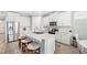 Island kitchen with stainless steel appliances and white cabinets at 17833 Blazing Star Cir, Clermont, FL 34714