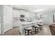 Open concept kitchen with island and stainless steel appliances at 17833 Blazing Star Cir, Clermont, FL 34714
