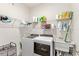 Laundry room with washer, dryer, and storage shelves at 17833 Blazing Star Cir, Clermont, FL 34714