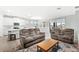 Living room with two brown reclining sofas and a coffee table at 17833 Blazing Star Cir, Clermont, FL 34714