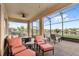 Covered patio overlooks a lake; perfect for outdoor living at 17833 Blazing Star Cir, Clermont, FL 34714