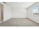 Large bedroom with neutral paint and carpet and a window allowing for natural light at 2316 Citrus Bloom Dr, Bartow, FL 33830