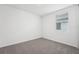 Bright bedroom with neutral paint, carpet and a window providing natural light at 2316 Citrus Bloom Dr, Bartow, FL 33830