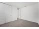 This bedroom has neutral paint and carpet and a large closet with sliding doors at 2316 Citrus Bloom Dr, Bartow, FL 33830