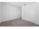 This bedroom features neutral paint and carpet and large closet with sliding doors at 2316 Citrus Bloom Dr, Bartow, FL 33830