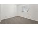 This bedroom has neutral paint, carpet and a window offering great natural light at 2316 Citrus Bloom Dr, Bartow, FL 33830
