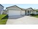 Charming single-Gathering home with a well-manicured lawn, two-car garage and a modern design at 2316 Citrus Bloom Dr, Bartow, FL 33830