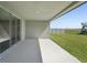 Covered patio with expansive views of the backyard, perfect for outdoor relaxation and entertaining at 2316 Citrus Bloom Dr, Bartow, FL 33830