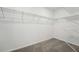 Walk-in closet with wire shelving and neutral carpet providing organized storage space at 2316 Citrus Bloom Dr, Bartow, FL 33830