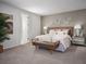 Relaxing main bedroom with cozy bedding and ensuite bath at 2332 Citrus Bloom Dr, Bartow, FL 33830