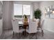 Elegant dining room with a round table and six chairs at 2332 Citrus Bloom Dr, Bartow, FL 33830