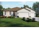 Beautiful home with three-car garage and lush landscaping at 2332 Citrus Bloom Dr, Bartow, FL 33830