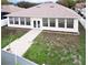 Single-story home with a large sunroom and fenced backyard at 2485 Huron Cir, Kissimmee, FL 34746