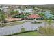 Aerial view of the community with a pool, lake and tennis courts at 2485 Huron Cir, Kissimmee, FL 34746
