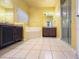 Bright Primary bathroom with double vanity, soaking tub, and glass-enclosed shower at 2485 Huron Cir, Kissimmee, FL 34746