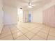 Large bedroom with tile floors and ceiling fan at 2485 Huron Cir, Kissimmee, FL 34746